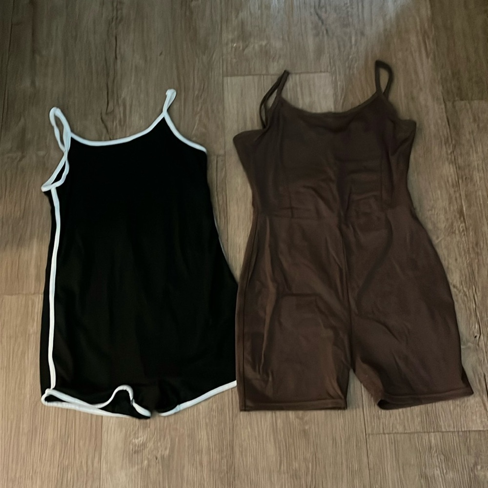 Athletic biker cut jump suits, both medium, tightly fitting.